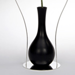 <p><strong><a href=andrea-branzi.html class=link-lightbox>Andrea Branzi</a></strong><br />Uomini e Fiori</p><p><strong>Italico</strong><br />Flower vase in natural  black ceramic “bucchero“ with metal <br />Base and frame silver  plated.<br />30 x h. 44 cm.</p><p>Limited edition of 20  signed and numbered pieces.</p> 